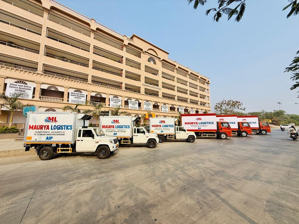 Line-up of Bolero pickup reefers outside the Maurya Logistics facility